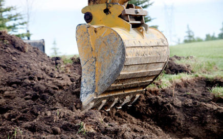 A Backhoe Digging a Trench